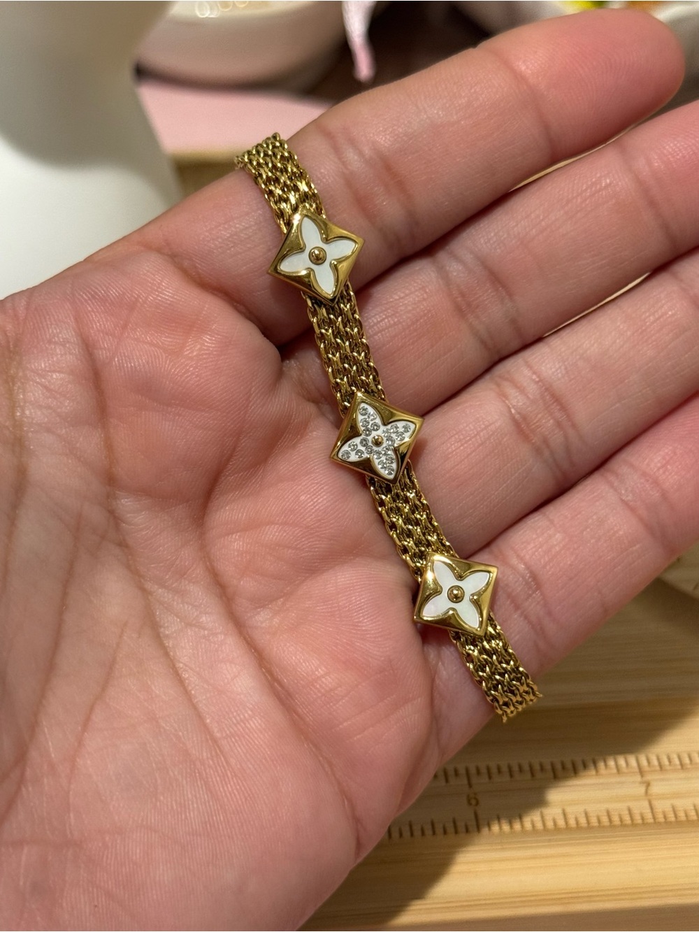 Gold-Tone Floral Link Bracelet with White Enamel Accents